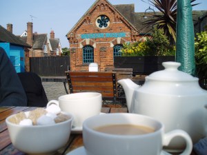 Bel and The Dragon Tea at Bel and The Dragon, with the Riverside Museum in the background